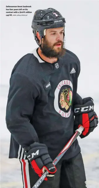  ?? KAMIL KRZACZYNSK­I/AP ?? Defenseman Brent Seabrook has four years left on his contract with a $6.875 million cap hit.