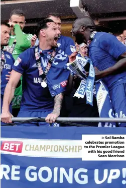  ??  ?? > Sol Bamba celebrates promotion to the Premier League with his good friend Sean Morrison