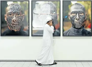  ?? Picture: Getty Images ?? MODERN ART Photograph­s in The Louvre Abu Dhabi Museum in Abu Dhabi.