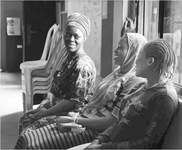  ??  ?? Nofisat, left, Azeezat, centre, and Goji visit a small health centre earlier this month in Lagos, Nigeria, that is supported by the UN Population Fund. • Nurse Catherine Ugwuezuoha sees to Supo Nofisat in Lagos. Ugwuezuoha, who has counselled Nofisat...