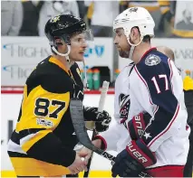  ?? GETTY IMAGES ?? Pittsburgh’s Sidney Crosby, left, shakes hands with Brandon Dubinsky of the Blue Jackets following Thursday’s 5-2 series-clinching win for the Pens. Despite the loss, Columbus enjoyed a turnaround season.