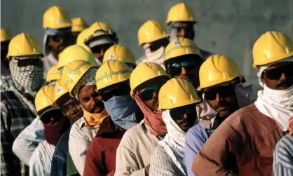  ??  ?? Workers on a constructi­on site near Doha. Photograph: Bill Lyons/Alamy