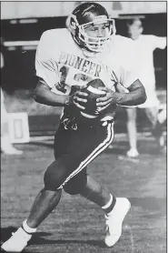  ?? Courtesy photo ?? Rick Still rolls out to pass during a junior high game in 1988. As a high school senior, Still was named the All-Arkansas first-team quarterbac­k by the Arkansas Democrat-Gazette.