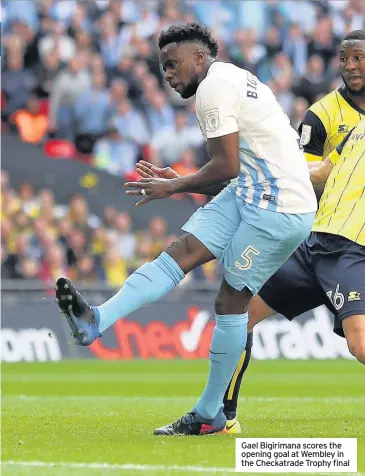  ??  ?? Gael Bigirimana scores the opening goal at Wembley in the Checkatrad­e Trophy final