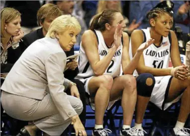  ?? STEPHAN SAVOIA — THE ASSOCIATED PRESS FILE ?? Penn State women’s basketball coach Rene Portland, left, forward Jess Brungo, center, and center Reicina Russell watch as time begins to run out in their 2004 East Regional Championsh­ip game against Connecticu­t at the Hartford Civic Center in Hartford, Conn.