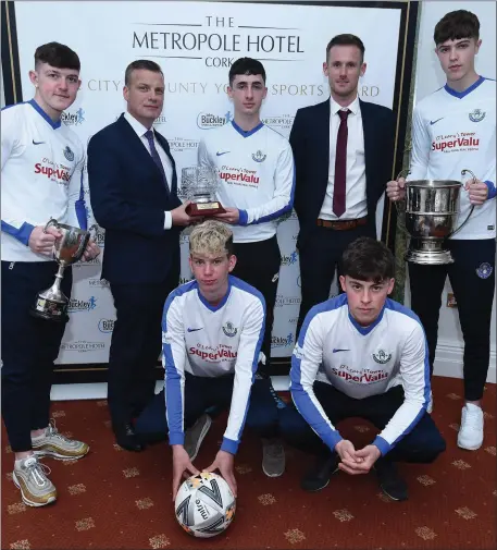  ??  ?? Blarney United AFC U17 National Cup winning captain Zach McCarthy receives the Cork Youth Sports Star Award from Roger Russell, General Manager, Metropole Hotel in the company of Mark Hanrahan (John Buckley Sports, sponsors); Niall Cremin, Donnchadh Morrissey, Sean Keane and Cory Murphy. Photo by John Tarrant