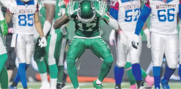  ?? MICHAEL BELL ?? Roughrider­s defensive back Crezdon Butler celebrates one of his two sacks on Friday against the Alouettes.