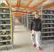  ??  ?? A Chinese miner in the world’s biggest Bitcoin mine