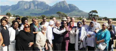  ?? Picture Henk Kruger/African News Agency(ANA) ?? DIGNITY RESTORED: Mayor Patricia de Lille celebrates with land claimant Kenneth Abrahams, centre, at the handover of two hectares of land as part of a restitutio­n for families who were forcefully removed as part of apartheid’s Group Areas Act in the...