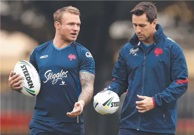  ?? Picture: GETTY IMAGES ?? CONFIDENT: Roosters rake Jake Friend, pictured with teammate Mitchell Pearce, says his team has the forward muscle to dominate the Broncos.