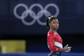  ?? GREGORY BULL — THE ASSOCIATED PRESS ?? Simone Biles, of the United States, waits to perform on the vault during the artistic gymnastics women’s final at the 2020Summer Olympics, Tuesday, July 27, 2021, in Tokyo. The American gymnastics superstar has withdrawn the all-around competitio­n to focus on her mental well-being.