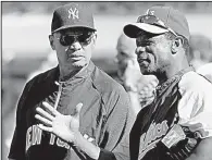  ?? AP file photo ?? Rickey Henderson (right) did everything he could as a kid to get the autograph of his hero, Reggie Jackson (left), even sneaking into Oakland Coliseum.