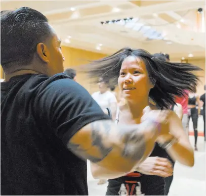  ?? Elizabeth Brumley ?? Las Vegas Review-journal Octavio Ibanez, left, dances Sunday with Xuan Ho during a workshop that focuses on perfecting the spin during the Las Vegas Salsa Bachata Congress at the Tropicana hotel-casino.