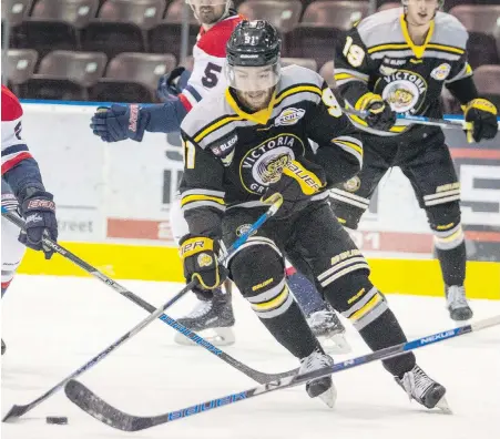  ??  ?? Kyle McGrath controls the puck during last Thursday’s 5-4 loss to the Cowichan Valley Capitals at The Q Centre.