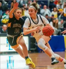  ?? Steve Mellon/Post-Gazette ?? Mt. Lebanon’s Ashleigh Connor drives past Red Lion’s Brooke Carr Tuesday night in a Class 6A first-round game.