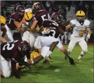  ?? AUSTIN HERTZOG - MEDIANEWS GROUP FILE ?? Pottsgrove’s Isaiah Taylor breaks through the line on a carry against Pope John Paul II last season.