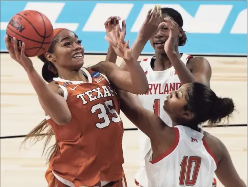  ?? Morry Gash / Associated Press ?? Texas’s Charli Collier shoots over Maryland’s Angel Reese during the second half in the Sweet 16 round of the NCAA tournament in San Antonio in March.