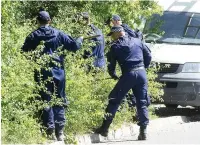  ??  ?? ●The police search after Mrs McCann’s remains were found at Reddish Vale Country park