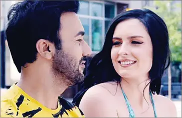 ?? – Special to The Herald ?? A screenshot from a Punjabi music video in which Osoyoos model Ittia Edwards starred with singer Gurvinder Brar. The scene pictured was shot in downtown Penticton, and the video had been viewed one million times on YouTube as of Wednesday.