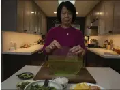  ?? CHLOE AFTEL — THE NEW YORK TIMES ?? Andrea Nguyen with her most beloved kitchen utensil, her rice paper dipping bowl, at her home in Santa Cruz.