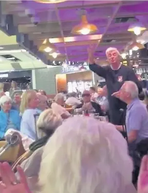  ??  ?? Members of Cwmbach Male Choir entertaine­d passengers at Gatwick Airport