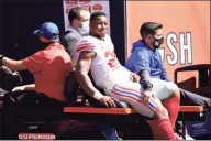  ?? Nam Y. Huh / Associated Press ?? New York Giants running back Saquon Barkley is carted to the locker room after being injured during the first half against the Chicago Bears in Chicago on Sunday.