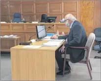  ?? ASHLEY FITZPATRIC­K/THE TELEGRAM ?? Newfoundla­nd and Labrador Hydro president Jim Haynes makes a note just before the end of a mid-morning break in proceeding­s at a Board of Commission­ers of Public Utilities hearing in St. John’s on Monday.