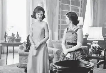  ??  ?? Balfour (left) as Jackie Kennedy and Foy as Queen Elizabeth II in Season 2 of Netflix’s ‘The Crown’. (Below) Foy and Smith in ‘The Crown’. — Courtesy of Netflix