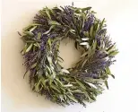  ?? Associated Press ?? Pottery Barn offers a dried lavender and olive branch wreath.