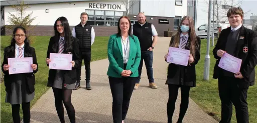  ??  ?? ●● The competitio­n winners with deputy head of St Cuthbert’s Claire Hunt, and the sponsors