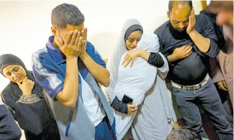  ?? AP ?? Members of the Abu Draz family mourn their relatives killed in the Israeli bombardmen­t of the Gaza Strip, at their house in Rafah, southern Gaza, on April 4.