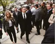  ?? Arnold Gold / Hearst Connecticu­t Media ?? Connecticu­t State Police Trooper Brian North (center) walks into Milford Superior Court May 3, 2022, for an arraignmen­t in the death of Mubarak Soulemane, flanked by members of the Connecticu­t State Police Union.