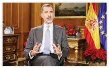  ??  ?? Spanish King Felipe VI delivers his Christmas Eve message at the Royal Palace in Madrid on Sunday. (AFP)