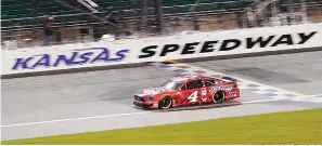  ?? AP Photo/Charlie Riedel ?? ■ Kevin Harvick drives during a NASCAR Cup Series auto race Thursday at Kansas Speedway in Kansas City, Kan.