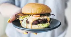  ?? ALEXA FERNANDO / THE CANADIAN PRESS ?? A vegan burger to be served at the soon-to-be-opened Rosalinda restaurant in Toronto.