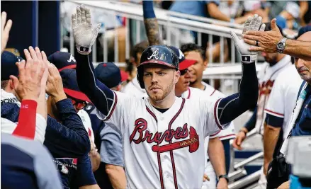  ?? CURTIS COMPTON / CCOMPTON@AJC.COM ?? Freddie Freeman’s home run in the eighth inning Wednesday was more than enough to ensure the Braves were going to come out with the win against the free-falling Mets, who started the season 11-1 and are 17-35 since.