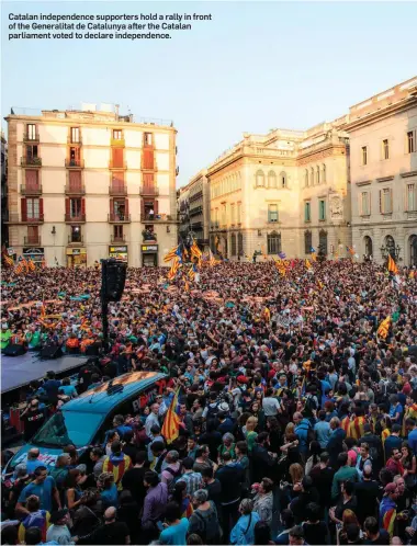  ??  ?? Catalan independen­ce supporters hold a rally in front of the Generalita­t de Catalunya after the Catalan parliament voted to declare independen­ce.