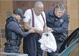  ?? Jacqueline Larma Associated Press ?? A HANDCUFFED Bill Cosby after his sentencing. The judge rejected an argument by Cosby’s lawyer that the 81-year-old entertaine­r was too frail for prison.