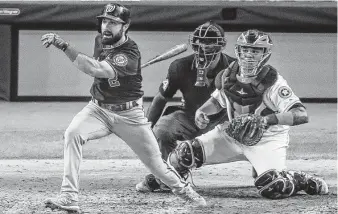  ?? Godofredo A. Vásquez / Staff photograph­er ?? Right fielder Adam Eaton gives the Nationals a 3-2 lead with a single during a three-run fifth inning. Juan Soto provided much-needed insurance with a two-run double later in the inning.