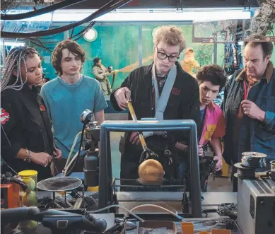  ?? ?? Celeste O’Connor, Finn Wolfhard, James Acaster, Logan Kim and Dan Aykroyd examine an ancient, spooky artifact in Ghostbuste­rs: Frozen Empire.