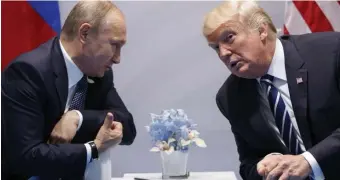  ?? AP FILE ?? BESTIES: A Republican-led committee has determined that President Trump’s campaign was aware of Russian interferen­ce on their behalf in the 2016 election.