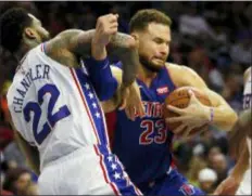  ?? LAURENCE KESTERSON — THE ASSOCIATED PRESS ?? Detroit’s Blake Griffin, right, is fouled by the 76ers’ Wilson Chandler during the first half.