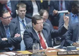  ?? Jewel Samad AFP/Getty Images ?? VLADIMIR SAFRONKOV, Russia’s deputy United Nations ambassador, tries to get the attention of U.S. Ambassador Nikki Haley at a Security Council meeting.