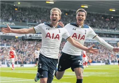  ??  ?? Tottenham’s Harry Kane, left, celebrates his goal against Arsenal with Dele Alli at White Hart Lane.