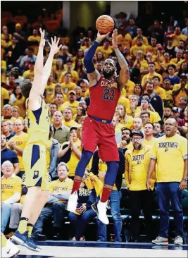  ?? ANDY LYONS/GETTY IMAGES ?? The Cavaliers’ LeBron James shoots the ball against the Pacers in Game 6 of the Eastern Conference first round Friday at Bankers Life Fieldhouse in Indianapol­is.