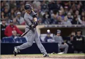  ?? ORLANDO RAMIREZ — THE ASSOCIATED PRESS ?? Arizona Diamondbac­ks pitcher Zack Greinke hits a threerun home run during the fourth inning of a baseball game against the San Diego Padres in San Diego.