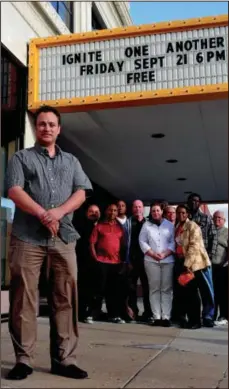  ?? MORNING JOURNAL/SAM GREENE ?? A group of local pastors gather with Pastor Danny Parsons yesterday in front of the Palace Theater in downtown Lorain.