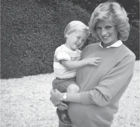  ?? THE DUKE OF CAMBRIDGE AND PRINCE HARRY / KENSINGTON PALACE VIA THE ASSOCIATED PRESS ?? In this photo made available by Kensington Palace from the personal photo album of the late Diana, Princess of Wales, shows the princess holding Prince William while pregnant with Prince Harry, and is featured in the new television documentar­y Diana,...