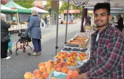  ?? The Daily Courier ?? Farmer Ranjeet Gill was among the vendors setting up early Sunday morning on the last day of the year for a satellite farmers market in downtown Kelowna.