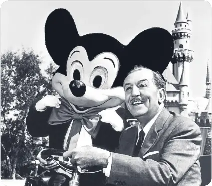  ??  ?? Walt Disney with Mickey Mouse at the opening of Disneyland, in 1955.